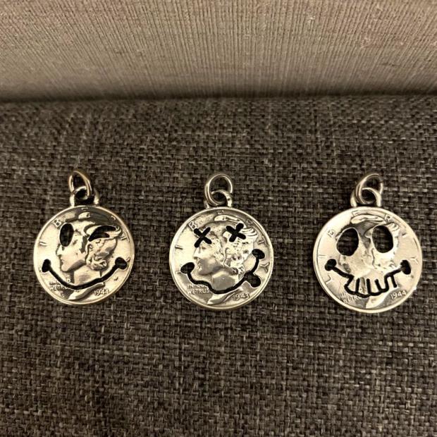 Silver coin smiling face skull pendant