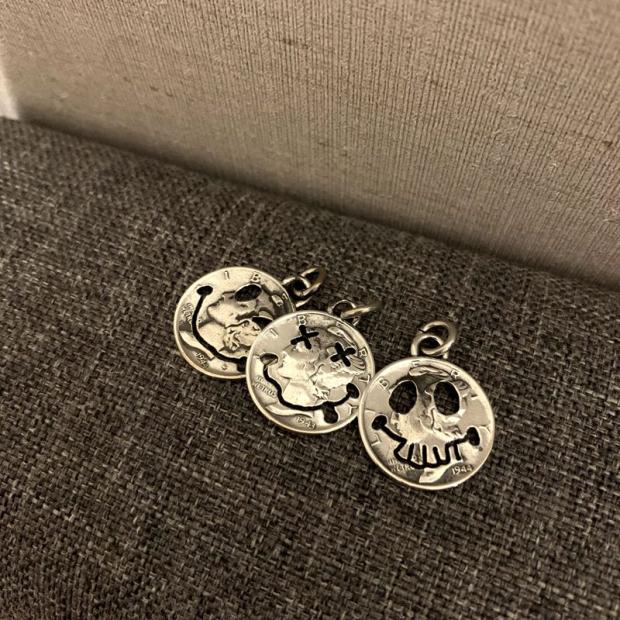 Silver coin smiling face skull pendant